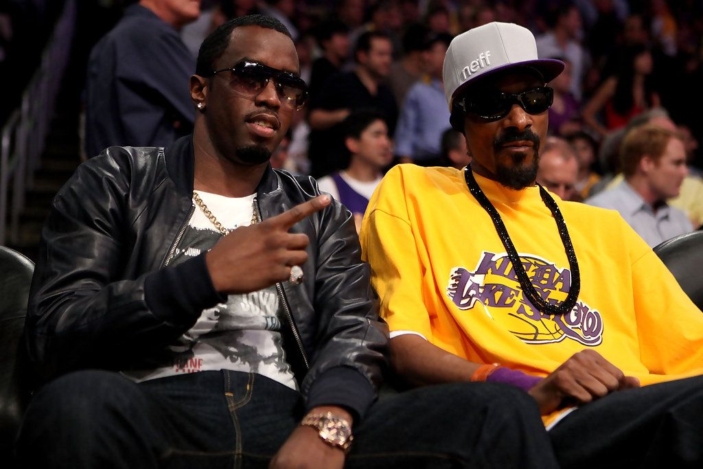 Diddy and Snoop Dogg courtside at a Lakers basketball game.